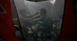 One photo that captures tenderness amid chaos in the Philippines as Typhoon Fung-wong hits