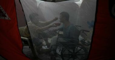 One photo that captures tenderness amid chaos in the Philippines as Typhoon Fung-wong hits