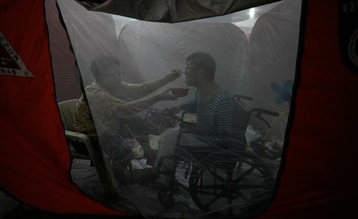 One photo that captures tenderness amid chaos in the Philippines as Typhoon Fung-wong hits