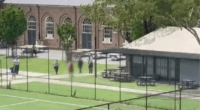 Police surrounding a student armed with a knife at North Sydney Boys High.