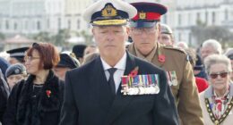 Police charge 'fake admiral' after appearing at Remembrance event