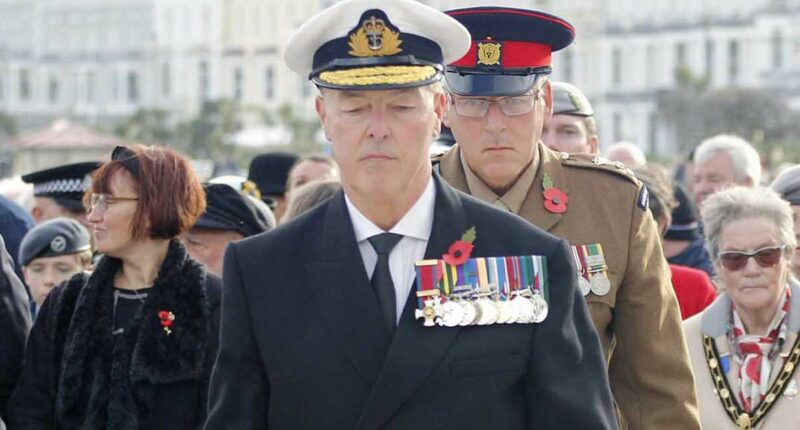 Police charge 'fake admiral' after appearing at Remembrance event