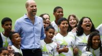 Prince William plays football with local children n Rio de Janeiro