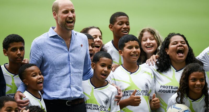 Prince William plays football with local children n Rio de Janeiro