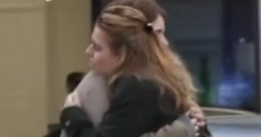 Princesses Beatrice and Eugenie share an emotional hug after intense conversation on a Mayfair street as disgraced father Andrew was officially stripped of his royal titles