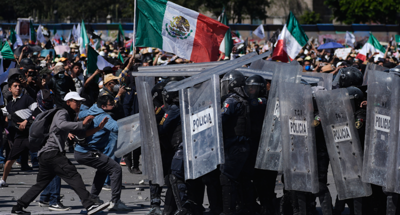 Protesters attack police, breach barrier at Mexico's National Palace during rally against cartel violence