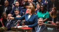 Rachel Reeves speaks from the despatch box in the House of Commons, gesturing with her right hand, surrounded by MPs.