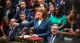 Rachel Reeves speaks from the despatch box in the House of Commons, gesturing with her right hand, surrounded by MPs.