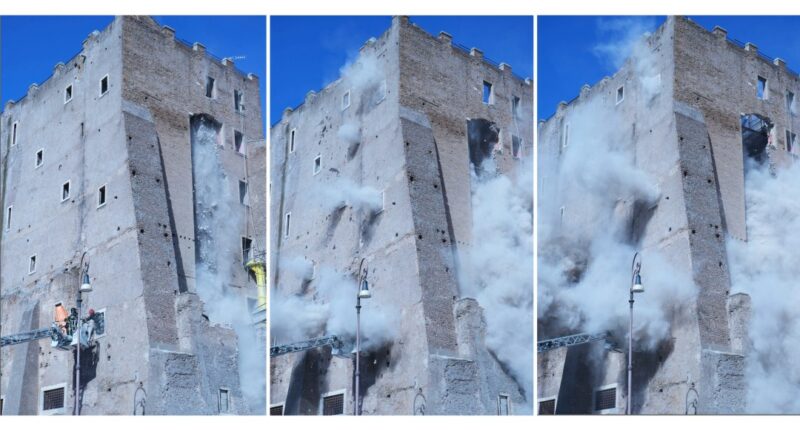 Rescuers work to reach worker trapped in medieval tower that partially collapsed in Rome