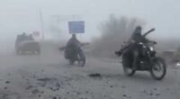 Russian column travelling in stripped-back cars advances through fog