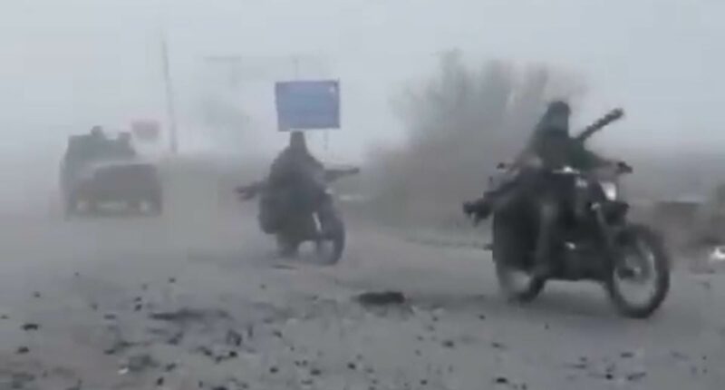 Russian column travelling in stripped-back cars advances through fog