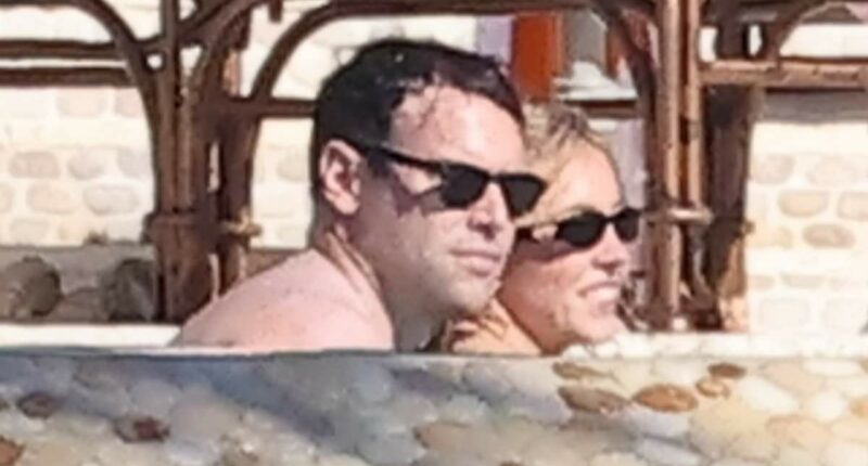 Sydney Sweeney wears swimsuit as she snuggles up to Scooter Braun