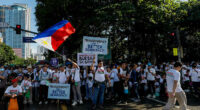 Tens of thousands rally in Manila over corruption scandal that implicates top Philippine officials