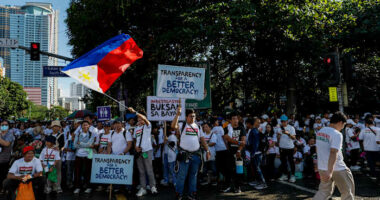 Tens of thousands rally in Manila over corruption scandal that implicates top Philippine officials