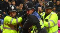 The shocking moment police officers are punched in the face at Aston Villa: New footage shows Swiss hooligans' disgraceful behaviour as violence returns to English football