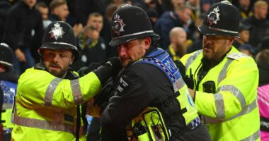 The shocking moment police officers are punched in the face at Aston Villa: New footage shows Swiss hooligans' disgraceful behaviour as violence returns to English football