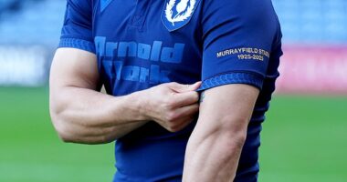 Scotland skipper Sione Tuipulotu shows off his country's commemorative jersey for the Murrayfield Test against the All Blacks