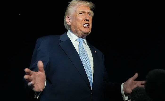 Trump defends Tucker Carlson after interview with activist known for his antisemitic views