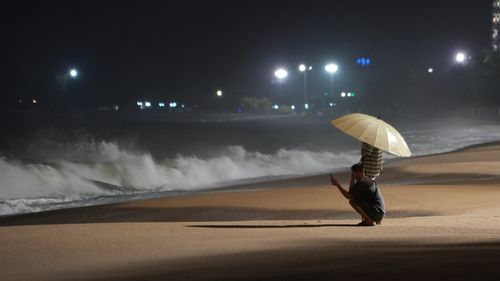 People watch rough waves caused by Typhoon Kalmaegi in Khanh Hoa, Vietnam on Thursday, November 6.