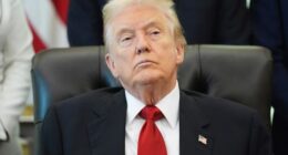 President Donald Trump listens as Health and Human Services Secretary Robert F. Kennedy Jr. speaks during an event about drug prices.