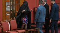 Uproar in Senate as Pauline Hanson surprises by wearing her old BURQA