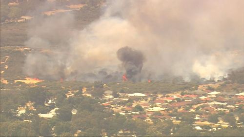 A bushfire burning in Kenwick, in Perth's east.