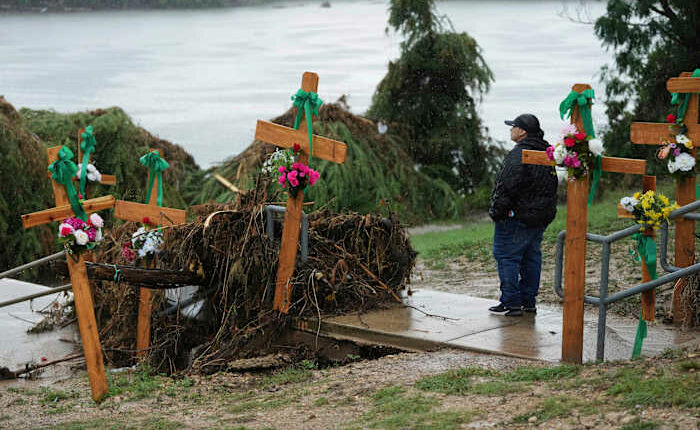911 callers trapped in flooded attics and inundated camp cabins beg for help as floodwaters rise