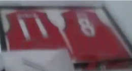 Red football jerseys framed for posterity.