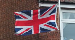 Adam Peaty's family fly Union Flag upside down as they stay miles away