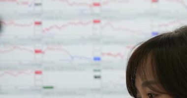 Asian shares are mixed, while gold and silver hit record highs