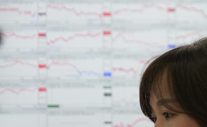 Asian shares are mixed, while gold and silver hit record highs