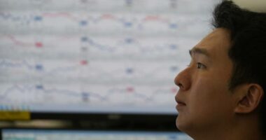 Asian shares climb after US stocks rise at the start of a holiday-shortened week