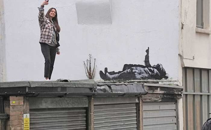 Banksy unveils new art in London following speculation over murals depicting stargazing figures