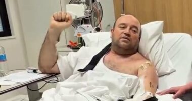 Bondi hero is handed $2.5million cheque in his hospital bed