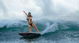 British woman 'rides into the record books' surfing wave in Portugal