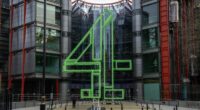 Channel 4 headquarters building with a large green Channel 4 logo sculpture in front of the glass entrance.