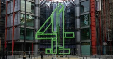 Channel 4 headquarters building with a large green Channel 4 logo sculpture in front of the glass entrance.