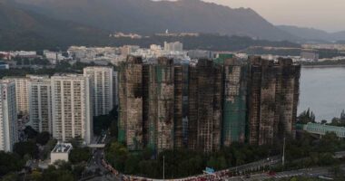 Hong Kong police arrest man for posts about deadly fire