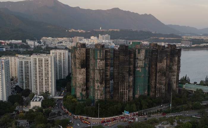 Hong Kong police arrest man for posts about deadly fire