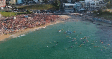 Hundreds of people paddle-out at Bondi Beach