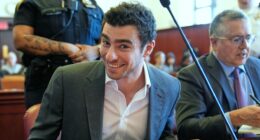 Luigi Mangione smiles for cameras in court as defense claims police violated his rights