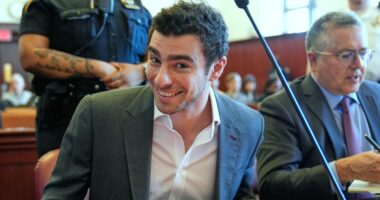 Luigi Mangione smiles for cameras in court as defense claims police violated his rights