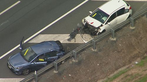 The driver of the white Kia, a woman in her 30s, is cooperating with police.