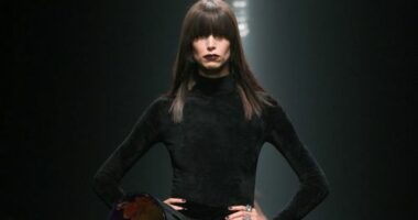 Model on the runway at the Versace Fall RTW 2025 fashion show as part of Milan Fashion Week.