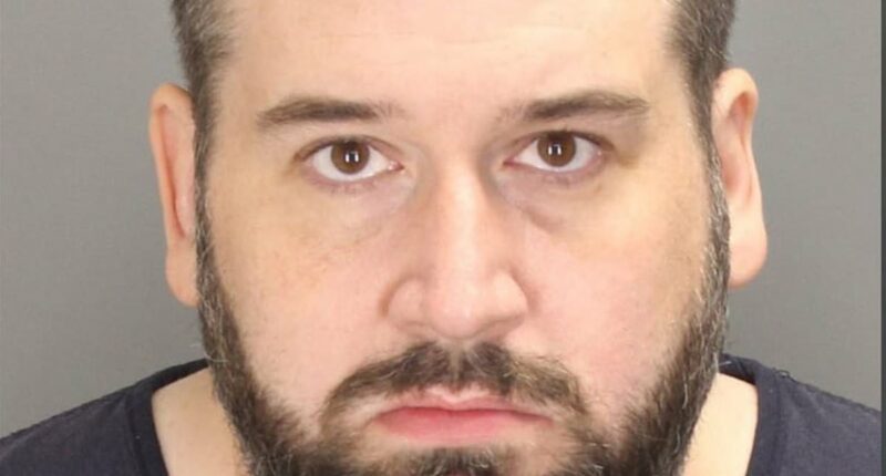 Millionaire charged with torching treasured lakeside hotel that was Minnesota's oldest after cracking JOKES about burning it down