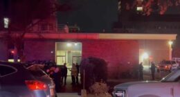 In this image from video, law enforcement officials gather outside the Brown University campus in Providence, R.I., on Saturday, Dec. 13, 2025. (AP Photo/Kimberlee Kruesi)