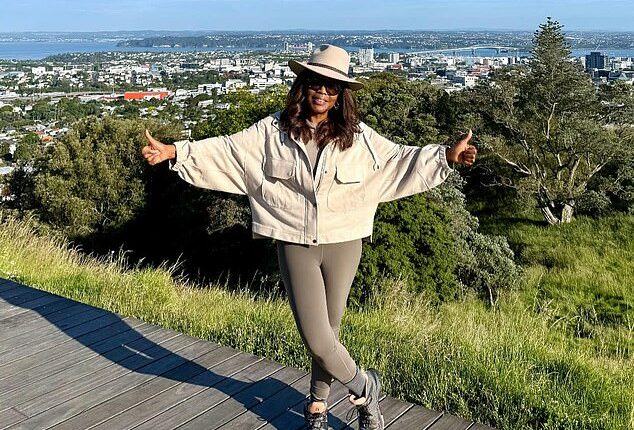 Oprah Winfrey, 71, shared a picture on Instagram that displayed her amazingly fit physique on a boardwalk overlooking the city of Auckland, New Zealand