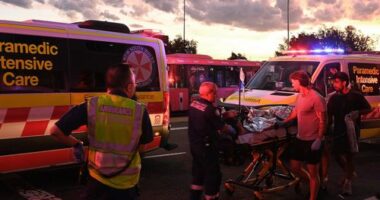 A person is transported to an ambulance in North Bondi following a shooting incident.