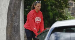 Rapist's mother Jo Silvagni breaks cover as she takes out the trash