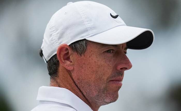 Rory McIlroy's late birdie burst means he'll be playing on the weekend at the Australian Open